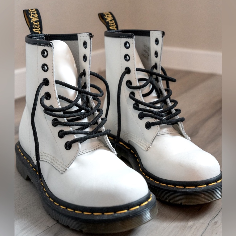 Dr. Martens white leather lace up boots.